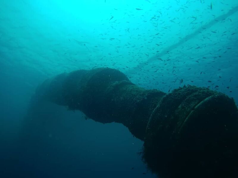 Submerged offshore pipeline stretching toward the surface