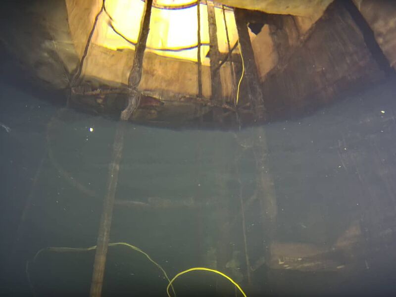 UUV view inside a water tank looking up toward the access hatch